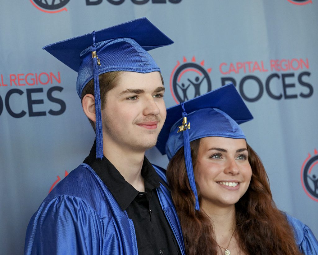 Two CTE students smile before the graduation ceremony begins.