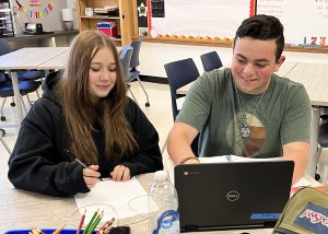 Students work on a computer