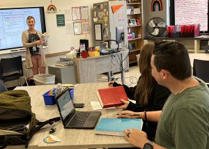 Students look at a teacher