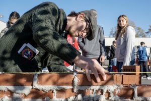 Dylan Garrant, Jr at Shenendehowa in Electrical Trades, learns masonry from Bricklayers and Allied Craftworkers