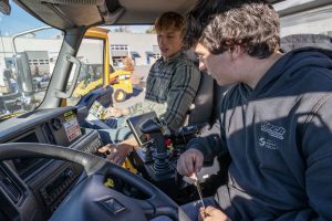 Owen VanVranken (front), junior of Bethlehem in Welding, and zvinvent Whiting, senior at Bethlehem in Welding 2, look at the inside of a DOT plow truck