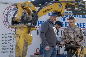 Nickolas Eilts, senior at Maywood from Schoharie, with Operating Engineer Bill Gray operating a remote machine