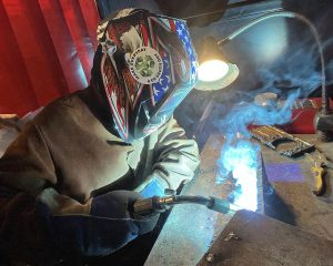 A student welds