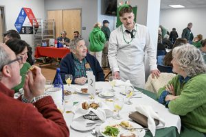 A student serves food